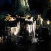 Lighting was installed to highlight the unique waterfall effects in this back yard pond.